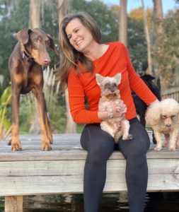 Angela Ardolino at Fire Flake Farm with her doberman and schnauzer